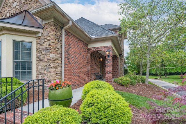 104 Hallmark Xing, Rock Hill, SC 29732 - property entrance featuring stone siding, brick siding, and roof with shingles