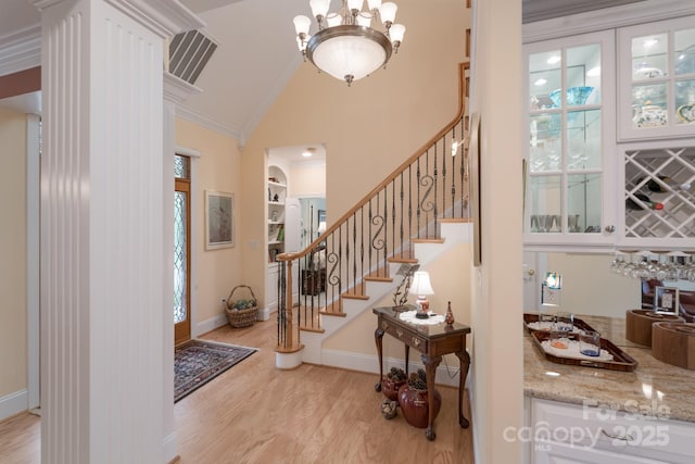 104 Hallmark Xing, Rock Hill, SC 29732 - foyer featuring light wood-style floors, high vaulted ceiling, stairs, visible vents, and ornamental molding