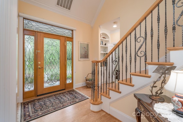 104 Hallmark Xing, Rock Hill, SC 29732 - foyer with visible vents, wood finished floors, stairway, and crown molding