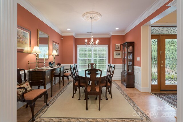 104 Hallmark Xing, Rock Hill, SC 29732 - dining room with recessed lighting, light wood-style flooring, a chandelier, ornamental molding, and a wainscoted wall