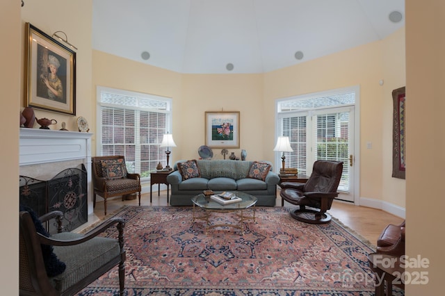 104 Hallmark Xing, Rock Hill, SC 29732 - living area featuring a fireplace, wood finished floors, high vaulted ceiling, and baseboards