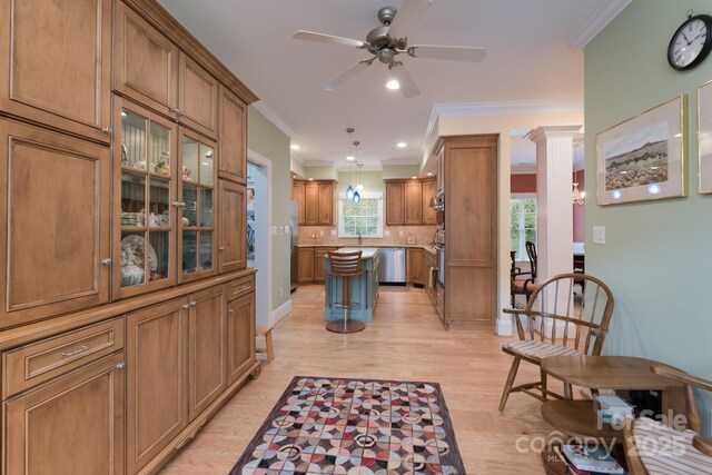 104 Hallmark Xing, Rock Hill, SC 29732 - kitchen with crown molding, ceiling fan, stainless steel appliances, a center island, and brown cabinetry