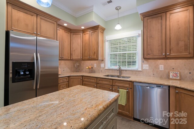 104 Hallmark Xing, Rock Hill, SC 29732 - kitchen with light stone countertops, a sink, stainless steel appliances, decorative light fixtures, and ornamental molding