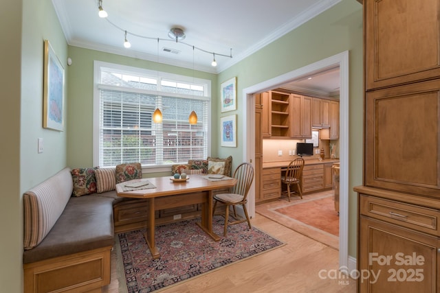 104 Hallmark Xing, Rock Hill, SC 29732 - dining room with light wood finished floors, breakfast area, rail lighting, crown molding, and visible vents