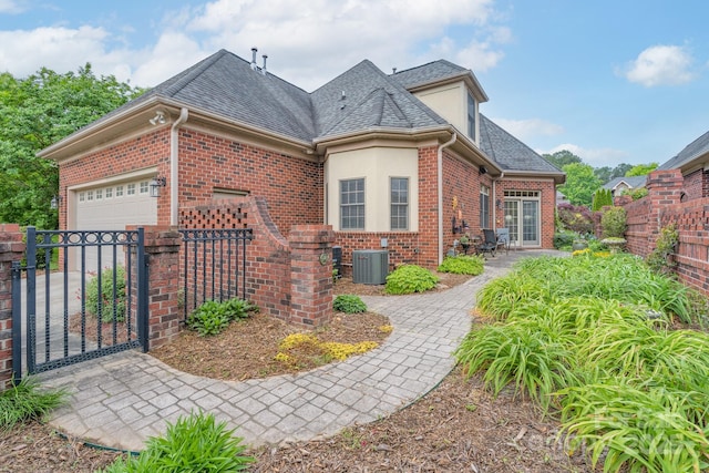 104 Hallmark Xing, Rock Hill, SC 29732 - view of front of property with a gate, a shingled roof, fence, central AC, and brick siding