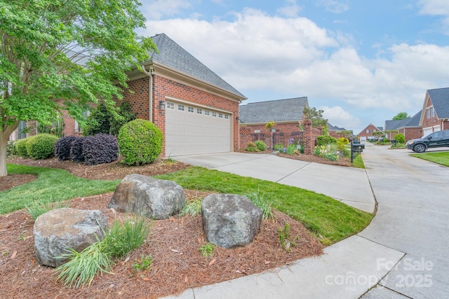 104 Hallmark Xing, Rock Hill, SC 29732 - view of home's exterior with driveway, roof with shingles, an attached garage, fence, and brick siding
