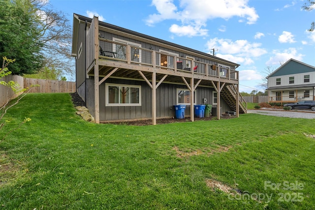 110 Hayden Way, Asheville, NC 28803 - rear view of property featuring board and batten siding, fence, a yard, and a wooden deck