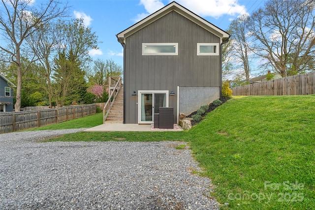 110 Hayden Way, Asheville, NC 28803 - rear view of house featuring stairs, a patio area, a fenced backyard, and a lawn