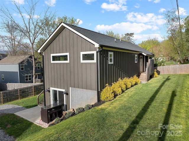 110 Hayden Way, Asheville, NC 28803 - view of property exterior featuring a yard, a patio area, board and batten siding, and fence