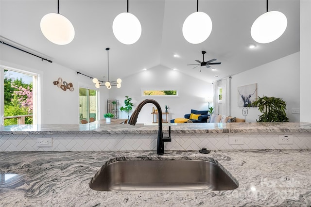 110 Hayden Way, Asheville, NC 28803 - kitchen featuring pendant lighting, light stone countertops, a sink, lofted ceiling, and open floor plan