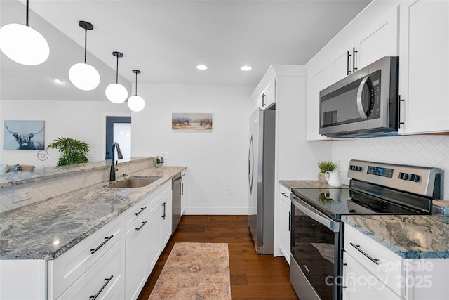 110 Hayden Way, Asheville, NC 28803 - kitchen with a peninsula, appliances with stainless steel finishes, dark wood-style flooring, a sink, and baseboards