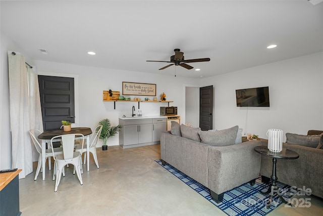 110 Hayden Way, Asheville, NC 28803 - living room with bar area, baseboards, recessed lighting, finished concrete flooring, and a ceiling fan