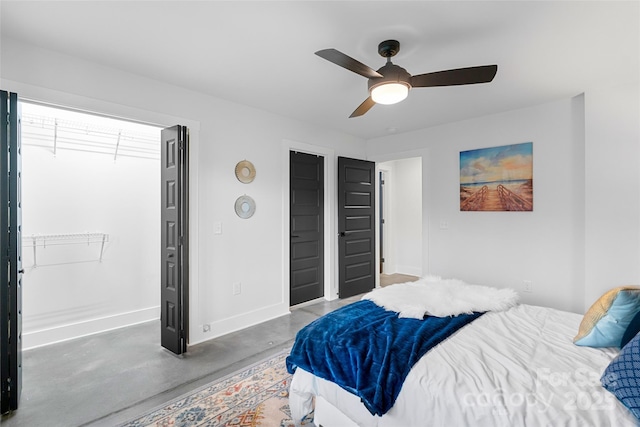 110 Hayden Way, Asheville, NC 28803 - bedroom with baseboards, ceiling fan, and finished concrete flooring