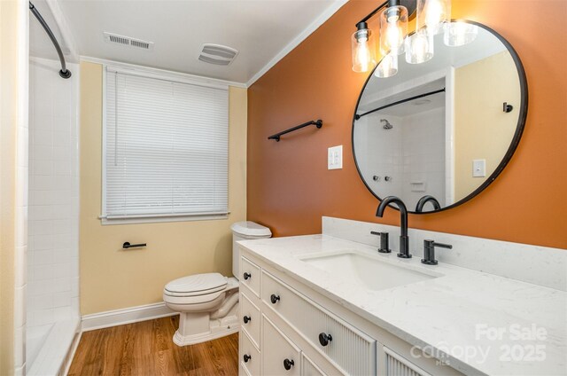 bathroom featuring a shower, wood finished floors, visible vents, and toilet