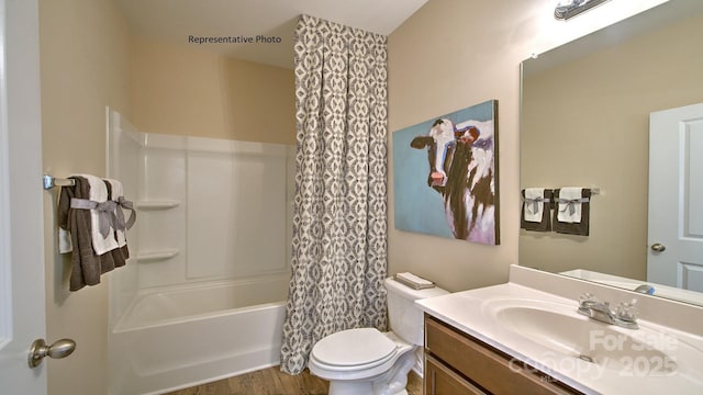 full bath featuring vanity, shower / tub combo, wood finished floors, and toilet