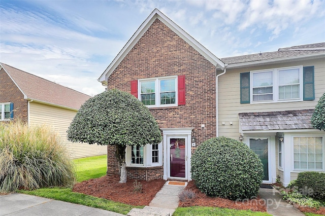 view of front of house featuring brick siding