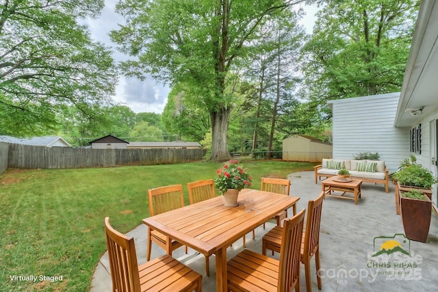 22025 Torrence Chapel Rd, Cornelius, NC 28031 - view of patio / terrace featuring an outdoor hangout area, outdoor dining area, and a storage shed