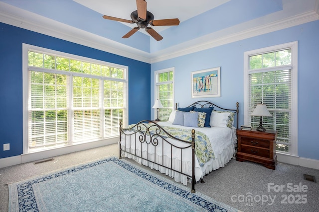bedroom with visible vents, ceiling fan, carpet floors, and crown molding