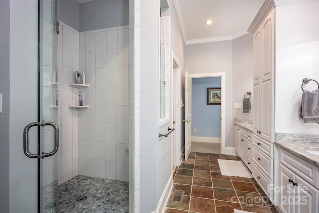 full bath with a stall shower, baseboards, stone tile flooring, and vanity