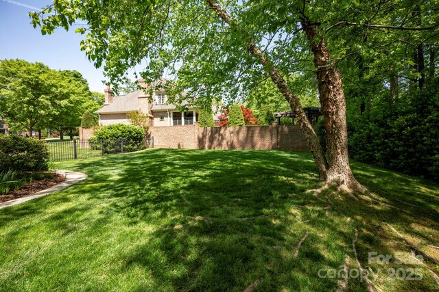 view of yard with fence