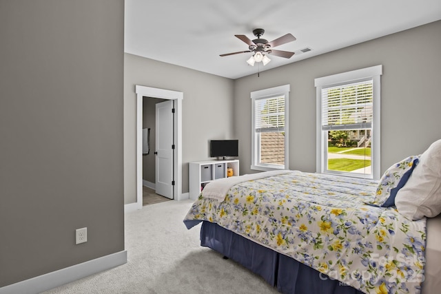 bedroom featuring carpet floors, a ceiling fan, baseboards, and visible vents