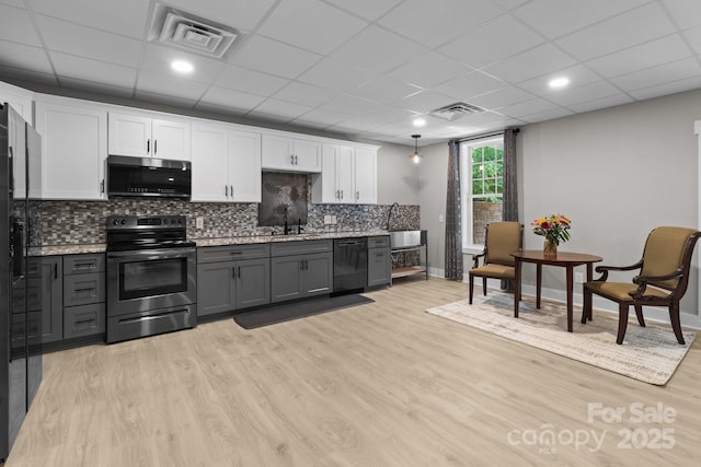 kitchen with gray cabinets, visible vents, dishwasher, white cabinets, and stainless steel electric stove