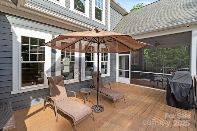 deck featuring a grill