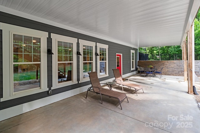 view of patio / terrace featuring fence