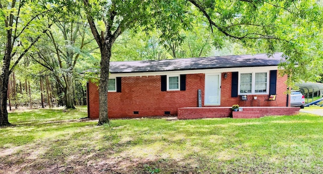 1780 Short St, Mount Pleasant, NC 28124 - ranch-style home with crawl space, a front yard, a detached carport, brick siding, and roof with shingles