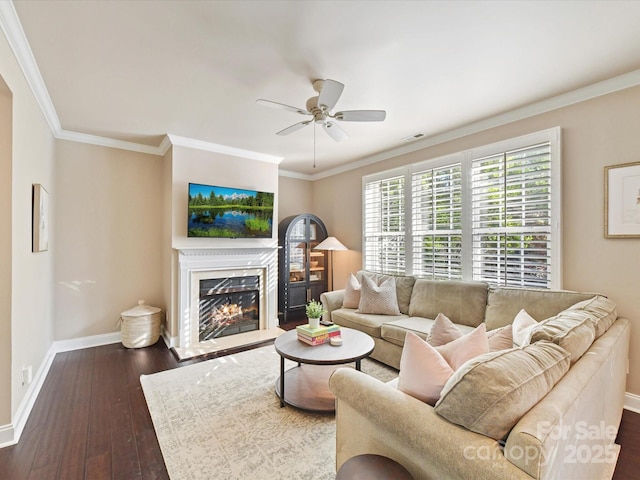 living room featuring ceiling fan, dark wood-style flooring, a fireplace, baseboards, and visible vents