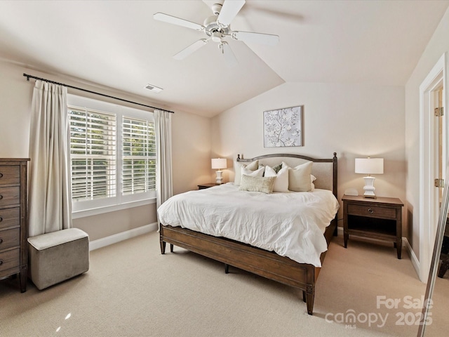 bedroom with baseboards, a ceiling fan, light carpet, and lofted ceiling