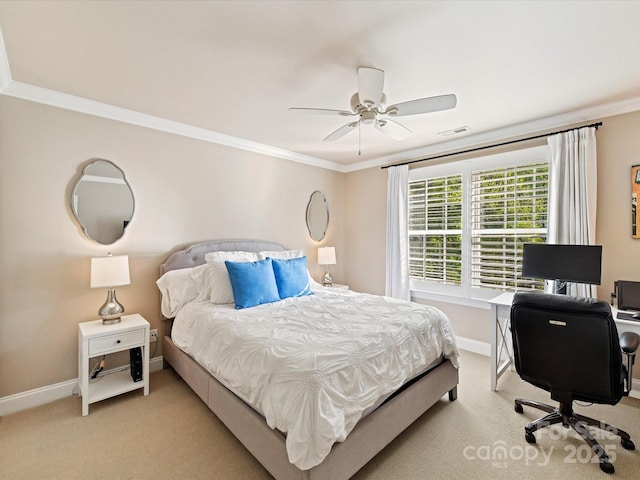 carpeted bedroom with visible vents, ornamental molding, and baseboards