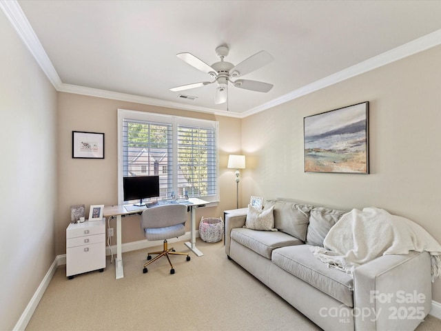 carpeted office featuring ornamental molding, visible vents, ceiling fan, and baseboards