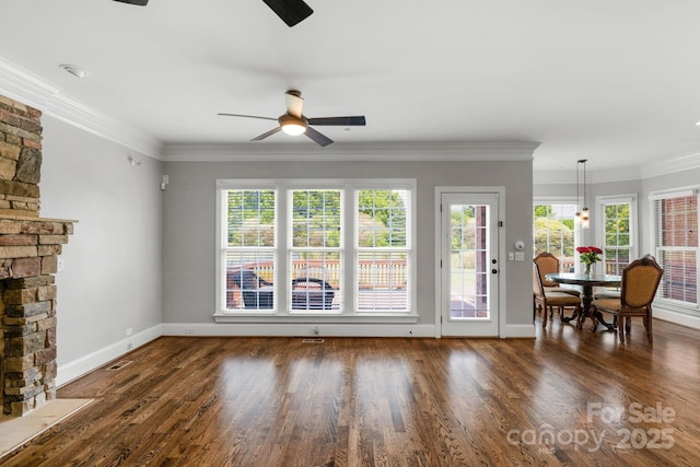9008 Skipaway Dr, Waxhaw, NC 28173 - living room with ceiling fan, baseboards, healthy amount of natural light, wood finished floors, and ornamental molding