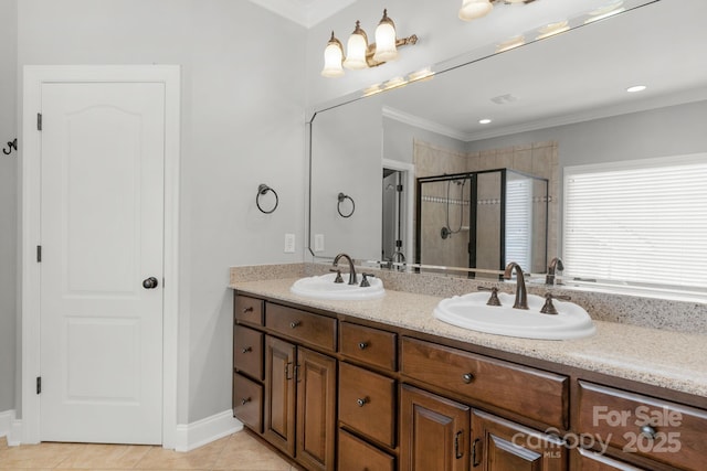 9008 Skipaway Dr, Waxhaw, NC 28173 - full bathroom with double vanity, a stall shower, crown molding, tile patterned floors, and baseboards