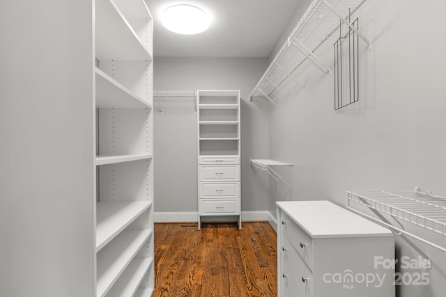 9008 Skipaway Dr, Waxhaw, NC 28173 - walk in closet featuring dark wood-style flooring
