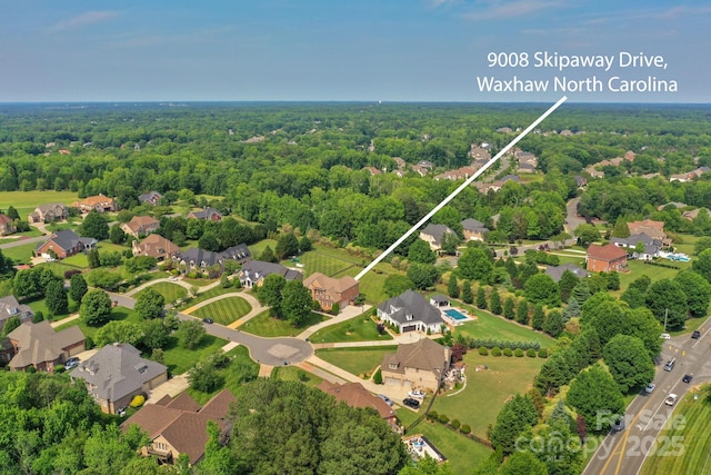 9008 Skipaway Dr, Waxhaw, NC 28173 - aerial view of residential area featuring a forest