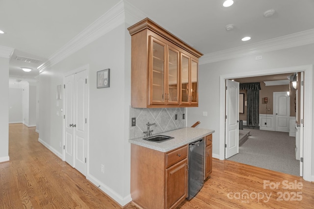 9008 Skipaway Dr, Waxhaw, NC 28173 - indoor wet bar featuring crown molding, light wood-type flooring, decorative backsplash, recessed lighting, and baseboards