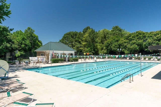 9008 Skipaway Dr, Waxhaw, NC 28173 - community pool with a patio and view of scattered trees