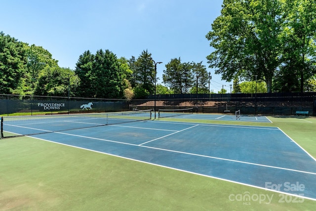 9008 Skipaway Dr, Waxhaw, NC 28173 - view of tennis court with community basketball court