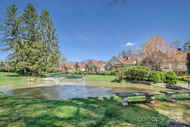 102 Glenbrook Dr, Hendersonville, NC 28739 - surrounding community with a yard and a water view
