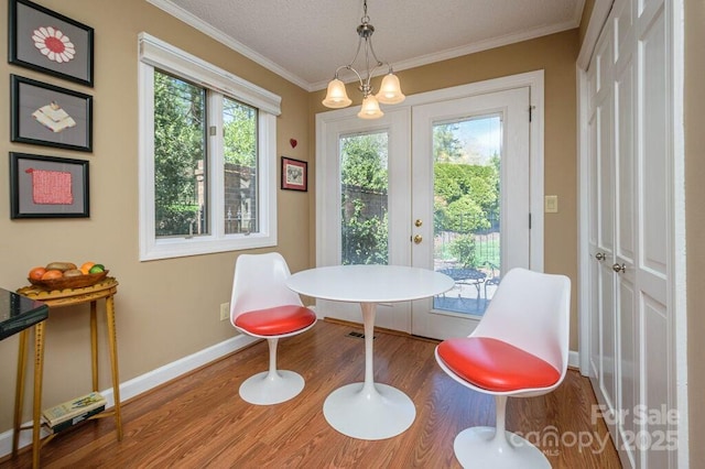 102 Glenbrook Dr, Hendersonville, NC 28739 - dining area with baseboards, crown molding, and wood finished floors