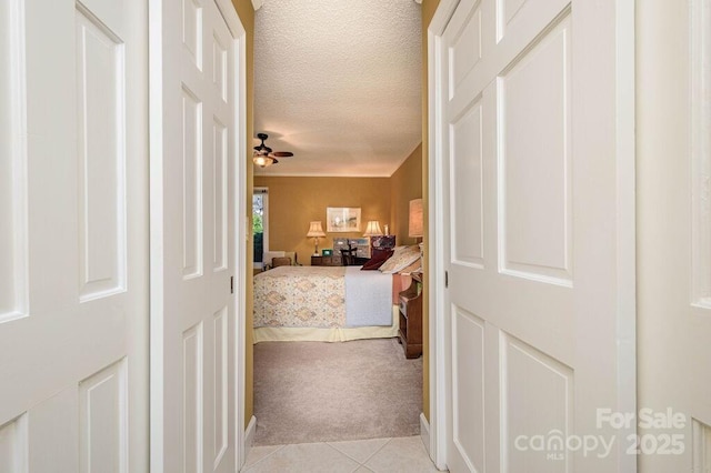 102 Glenbrook Dr, Hendersonville, NC 28739 - hall with light tile patterned flooring, light carpet, and a textured ceiling