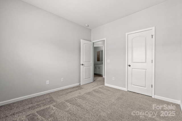 unfurnished bedroom featuring baseboards and carpet floors