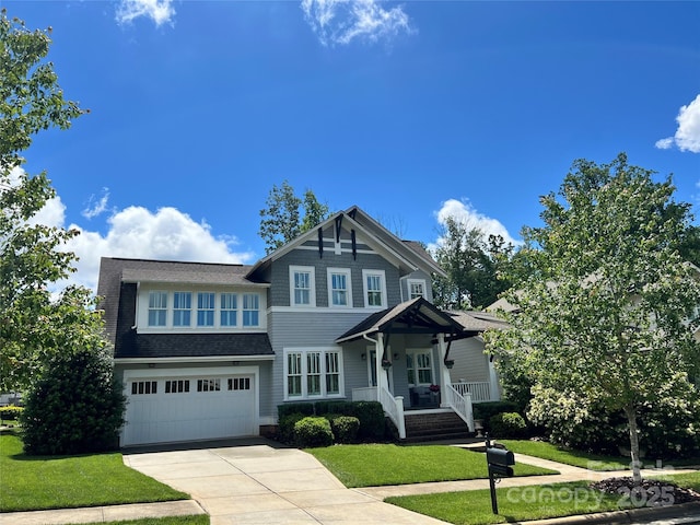 1550 Matthew Mcclure Cir, Davidson, NC 28036 - craftsman-style house featuring driveway, a garage, covered porch, a front yard, and a shingled roof