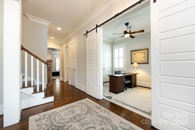 1550 Matthew Mcclure Cir, Davidson, NC 28036 - entrance foyer with a barn door, crown molding, a ceiling fan, stairs, and dark wood-style flooring