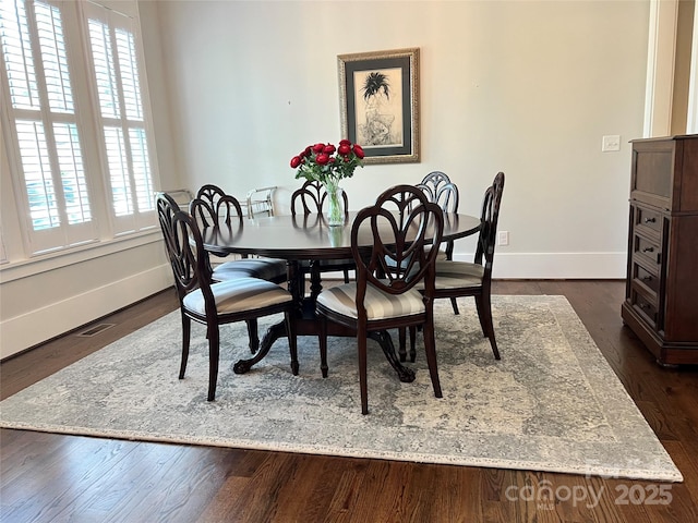 1550 Matthew Mcclure Cir, Davidson, NC 28036 - dining space with baseboards and dark wood finished floors