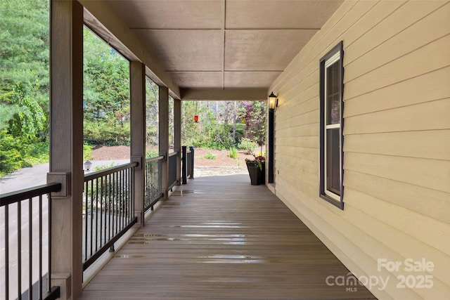 wooden terrace with a porch