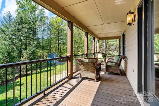 deck featuring a lawn