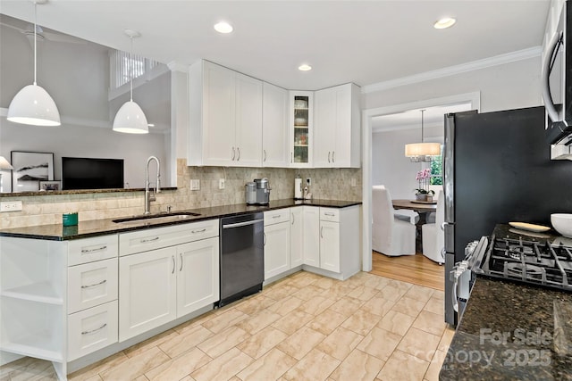 kitchen featuring a sink, dishwashing machine, dark stone countertops, and white cabinetry